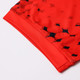 A close-up of a red football jersey featuring a patterned design and a logo. The fabric is 100% polyester.