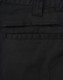 Close-up of black unisex cotton stretch ripstop work shorts, featuring a back pocket and visible stitching details.