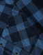 A unisex flannel plaid shirt in navy and blue tones, featuring button-up design and a chest pocket.