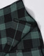 A unisex flannel plaid shirt featuring green and black checks, with buttons and a small pocket detail.