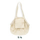 A small, cream cotton mesh tote bag with a solid pocket and straps for carrying.