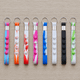 A selection of eight popper stress reliever key chains in various bright colours, featuring multiple buttons for popping.