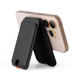 A black phone wallet stands upright against a smartphone, showcasing its sleek design and functionality.