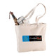 A zippered cotton canvas shopper tote in beige, featuring an umbrella and rolled newspaper inside, with a logo.