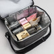 A grey insulated bag containing various snacks, including chocolates, crackers, and marshmallows.