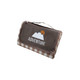 A medium picnic blanket in brown with a digital print featuring mountains and checkered edges. Includes a carry handle and logo.