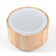 A bamboo Bluetooth speaker featuring a circular design with a perforated upper surface.