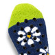 Custom cosy socks featuring a navy blue base with a floral pattern and a bright green top, adorned with grip dots.