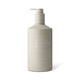 A cream bottle in a neutral beige shade with a pump dispenser, featuring a logo and "Great Barrier Reef" branding.