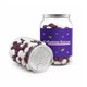 Clear jar filled with purple and white jelly beans, featuring a branding label on the side.