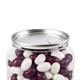 A clear can filled with purple and white jelly beans, topped with a metallic lid featuring a perforated design.