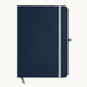 A navy blue A5 notebook with a grey elastic band and a ribbon bookmark. It features a logo on the cover.