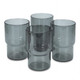 A set of four grey tumblers with a modern design, featuring a smooth finish and a subtle round shape.