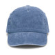 A vintage washed blue cap with a curved brim and a textured finish. Features a logo on the front.