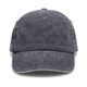 A vintage washed cap in a dark grey colour with an adjustable strap and a logo on the front.