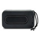 A black bass speaker with a smooth surface, featuring a USB port and a cord for easy carrying.