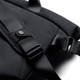 A black messenger bag featuring adjustable straps and a logo. The material appears textured and durable.