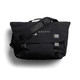 A black satchel bag with a shoulder strap and a logo, featuring front clasps and a flap cover.