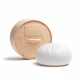 A squishy toy shaped like a steamed bun, featuring a round, woven base and a white bun-like top.