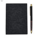 A black notebook and a black pen with a wooden accent, featuring a logo on the pen.