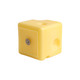 A square yellow candle shaped like cheese, featuring a smooth surface and rounded edges.