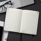 A5 daily diary for 2027, featuring blank pages for each day, with a black cover and a ribbon bookmark.