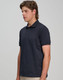 A men's ultrafine cotton pique polo in navy, featuring a classic collar and short sleeves, with a logo displayed.