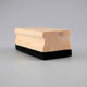 A wooden whiteboard eraser featuring a smooth wooden top and a black felt bottom.