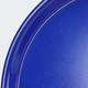 A blue serving tray with a textured surface and a smooth rim, featuring a circular shape and a glossy finish.