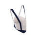 A medium canvas tote bag featuring a white body and navy blue accents, with adjustable straps and a logo.
