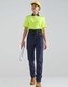 A pair of navy work pants with a flexible fit, worn with a fluorescent yellow polo shirt and a hard hat.