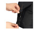 A person's hands adjusting a black buckle on an insulated cooler bag. The bag features a zippered opening and has branding.