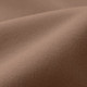 A close-up of smooth, elastic fabric in a warm brown colour, featuring fine weave texture.