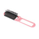 A folding hair brush with a mirror, featuring a pink handle and black bristles. Includes a logo on the handle.