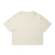 A cream-coloured cropped t-shirt with short sleeves and a round neckline. It has a logo on one side.