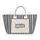 A large striped tote bag in navy and cream, featuring a front pocket with a logo.