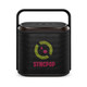 A compact black Bluetooth speaker with a handle and a colourful logo on the front.