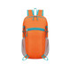 An orange packable hiking backpack with turquoise accents and mesh side pockets. Features multiple zippers for storage.