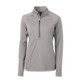 A grey women's half-zip top with long sleeves, featuring a zippered collar and a branding logo.