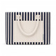 A striped tote bag featuring navy and cream colours, with a flat pocket and sturdy handles. It has a logo.