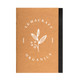 A brown A5 notebook with a black spine and a logo featuring a leaf and berries on the cover.