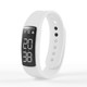 A white fitness tracker with a black display, featuring digital readouts and a sleek design.