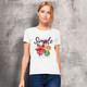 A white women's organic t-shirt featuring floral graphics and a logo on a textured background.