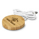 A round, bamboo wireless charger with a white USB cable, featuring a logo on the surface. A round, bamboo wireless charger with a white USB cable, featuring a logo on the surface.