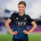 A women's performance rugby T-shirt in navy blue, featuring a logo and various patterns.