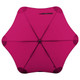 A pink BLUNT Classic Umbrella with a unique, eight-panel design and a central hub. It features a logo on the handle.