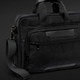 A black Swiss Peak Voyager Laptop Bag featuring multiple compartments and a detachable shoulder strap.