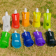 A collection of ten 500ml water pouches in various colours, each featuring a spout and some with logos.