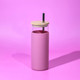A drink bottle featuring a pink body, a clear top, and a wooden lid with a straw. A drink bottle featuring a pink body, a clear top, and a wooden lid with a straw.