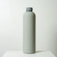 A drink bottle in a sleek, light grey finish, featuring a grey screw-top lid and a minimalist design.